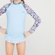 Camiseta Infantil Surf e Bodyboard FPU50+ 100 Olaian, azul-floral, 7-8 ANOS